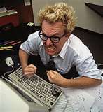  A man hitting the computer keyboard